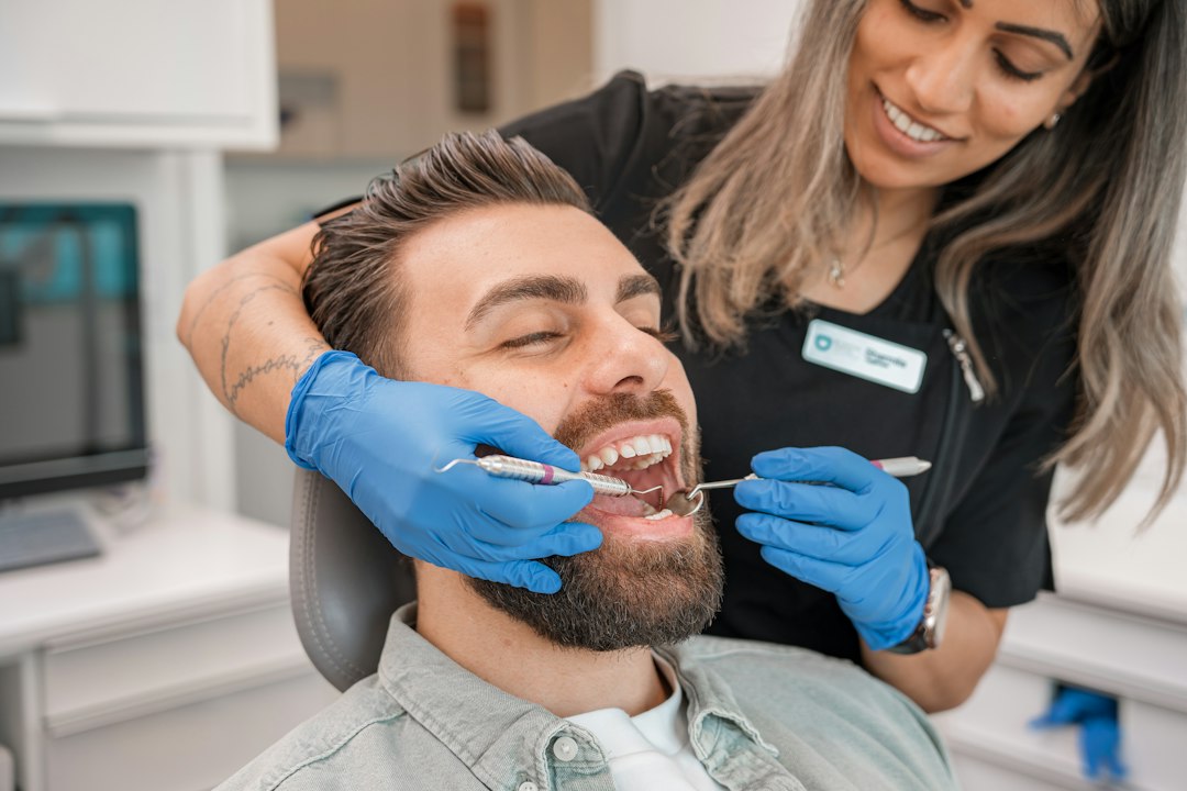 Dentist examining patient for early signs of periodontal disease